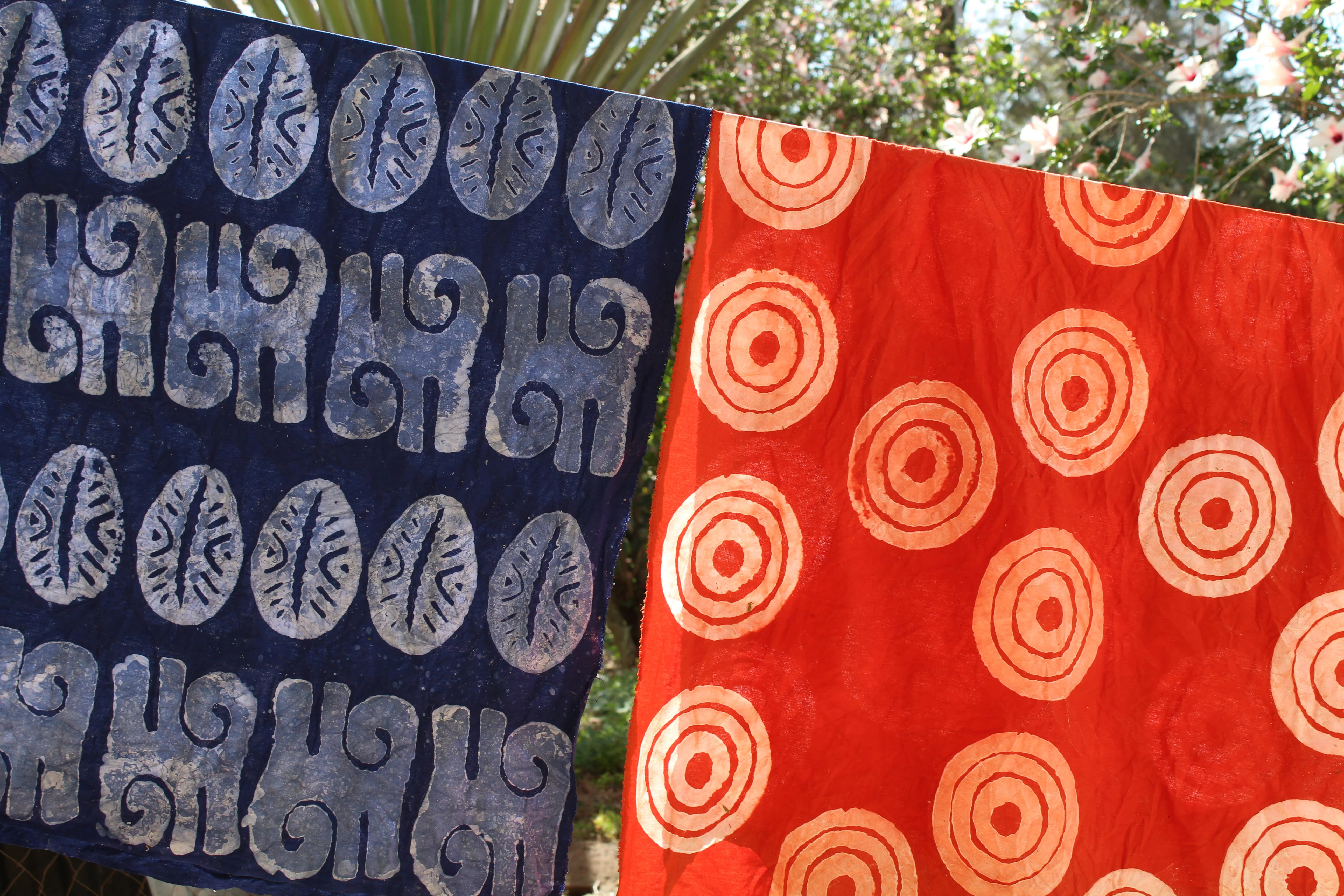 Patterned batik cloth hanging in the sun