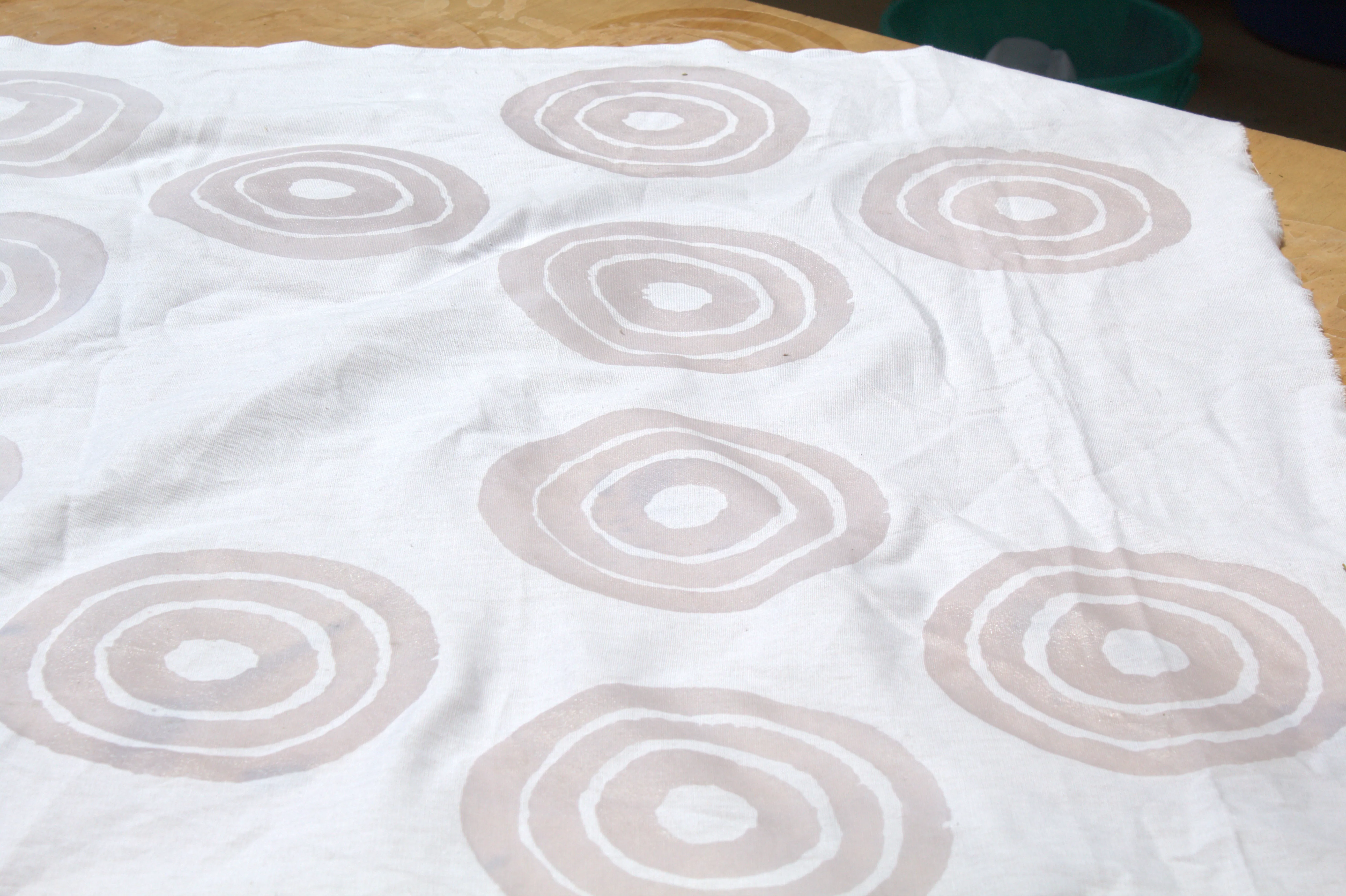 White cloth marked with circular wax patterns